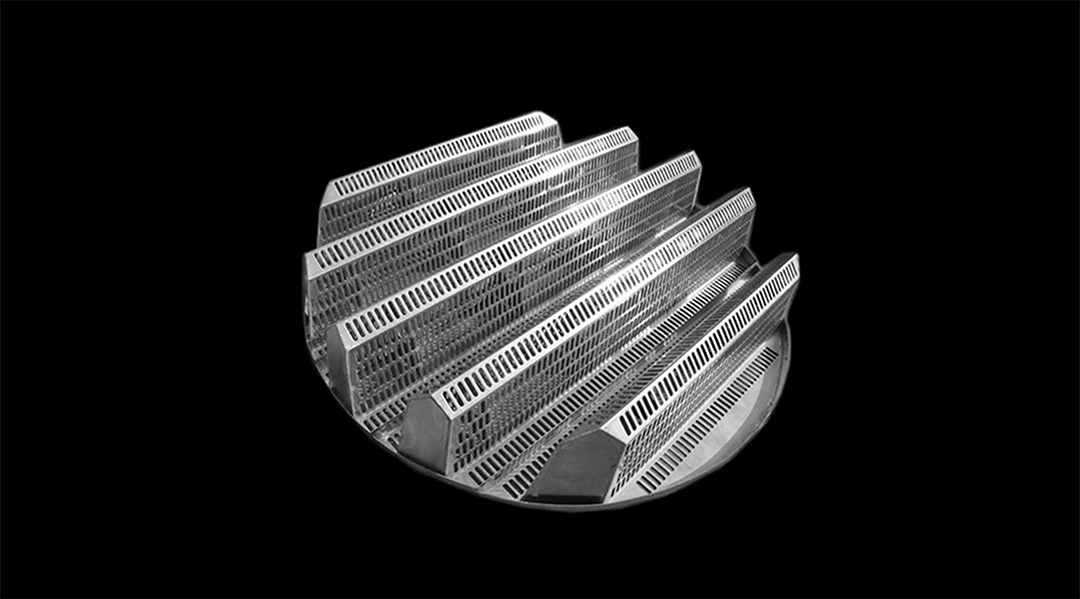 Complete tower internals assembly showing camel hump grid, structured packing, and liquid distributor